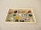 Tumbled gemstones in a wooden box