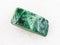 tumbled green jadeite stone on white marble