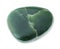 tumbled green Nephrite (Jade) gemstone on white