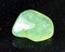 tumbled Prehnite rock on black