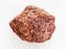 tumbled red pumice stone on white marble