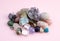 Tumbled and rough gemstones and crystals of various colors. Amethyst, rose quartz, agate, apatite, aventurine, olivine, turquoise