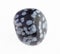 tumbled snowflake obsidian gem on white