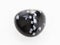 tumbled snowflake obsidian gemstone on white