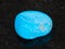 tumbled Turquenite (blue howlite) stone on dark