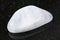 tumbled white moonstone (adularia) gem on dark