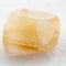 tumbled yellow banded Agate gemstone on white