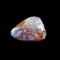 Tumbling opal stone on black background