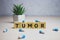 Tumor on wooden cubes, medical concept, background