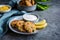 Tuna Fish cakes with green peas, corn and scallion served with sour cream dip