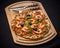 Tuna pizza with shrimp and cutlery