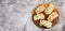 Tuna Salad open faced Sandwiches on a round wooden cutting board on a dark grey background