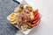 Tuna salad with potatoes and boiled egg called nicoise on white background