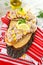 Tuna salad on toasted bread on a wooden background