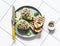 Tuna stuffed avocado - delicious healthy breakfast, snack, appetizer on a light background, top view