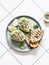 Tuna stuffed avocado - delicious healthy breakfast, snack, appetizer on a light background, top view