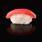 Tuna sushi on black mirroring background