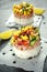 Tuna sushi stacks with mango, cucumber, tomatoes salsa served with balsamic vinegar, nigela ans sesame seeds