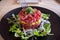 Tuna tartar dish with fork