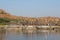 Tungabhadra river in the village of Hampi. Big stone. Tropical exotic landscape. Beautiful green valley. View from above