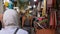 Tunis, Tunisia - 06 June 2018: tourist people walking and looking souvenirs and gifts on local market. Tourists people