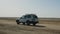 Tunis, Tunisia - 09 June 2018: off road car driving on sandy road while safari travel in desert Sahara. Safari car
