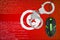 Tunisia flag and handcuffed computer mouse. Combating computer crime, hackers and piracy