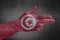 Tunisia flag painted on male hand like a gun