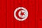 Tunisia flag painted on old wood plank