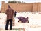 Tunisia to Hammamet fisherman prepares fishing nets on the beach