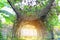 Tunnel archway in the garden with rays of sunlight