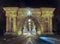 Tunnel in Budapest at night with traffic moving in front.