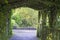 Tunnel of flowers, plants and woods in a municipal park in Adare, County Limerick, Ireland