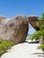 Tunnel of granite stones on the beach