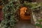 Tunnel leading to the upper courtyard on exhibition in the Gardens Almona collection, in the rays of the setting sun, in the Druze