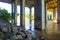 A tunnel of pillars under a freeway overpass with brown rushing river water with graffiti on the pillars at the Chattahoochee Rive