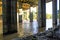 A tunnel of pillars under a freeway overpass with brown rushing river water with graffiti on the pillars at the Chattahoochee Rive