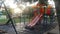 Tunnel and slider for children at the park in the evening.