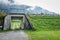 Tunnel under the railroad with green grass in autumn Switzerland