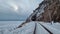 Tunnels and bridges winter circum-Baikal railway at the foot of the mountains on the coast of Lake Baikal, Siberia