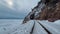 Tunnels and bridges winter circum-Baikal railway at the foot of the mountains on the coast of Lake Baikal, Siberia