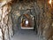 Tunnels through the cliffs at the foot of the Churfirsten mountain range on the road along the shore of Lake Walen or Walensee