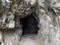 Tunnels through the cliffs at the foot of the Churfirsten mountain range on the road along the shore of Lake Walen or Walensee