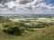 Tunning vibrant landscape image of English countryside on lovely Summer afternoon overlooking rolling hills and country villages
