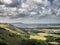 Tunning vibrant landscape image of English countryside on lovely Summer afternoon overlooking rolling hills and country villages