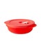 Tupperware plastic container. Plastic red food box with microwave valve closed lid isolated on white background. Food container.