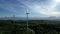 Turbine windmills for energy production. Windmills situated on a hill overgrown with trees. Drome - South of France