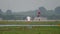 Turboprop plane taxiing in rainy weather