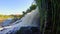 Turbulent waterfall splashing against rocks, river, wild nature