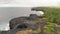 Turbulent waters near a rocky shoreline, amazing aerial view from drone